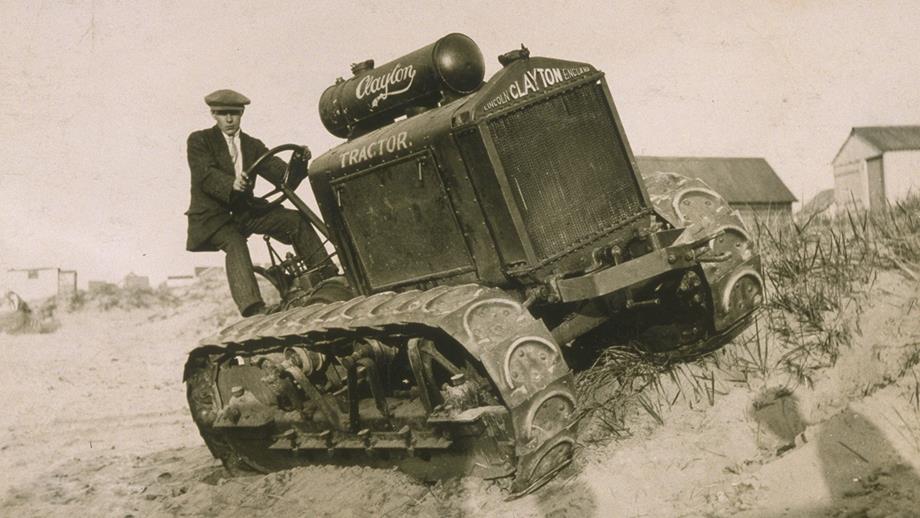 A volunteer atop a Clayton and Shuttleworth tractor