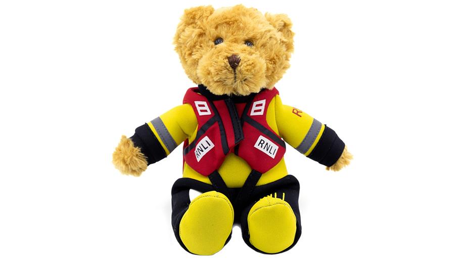 Teddy bear dressed in a miniature RNLI drysuit and lifejacket, branded RNLI, priced £12.