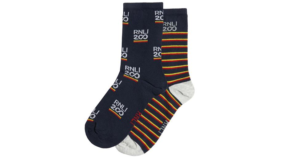Two pairs of socks with different navy, orange and red designs and RNLI 200 logo, priced £9.