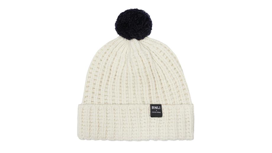 Woolly hat in white with a black pom-pom, priced £40.