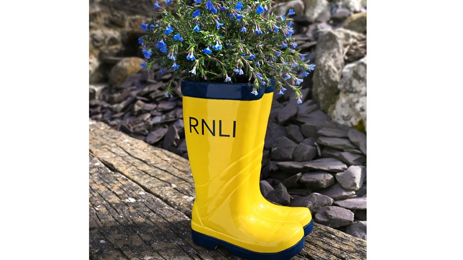 Small yellow welly planter with RNLI in black on the side, priced £15.