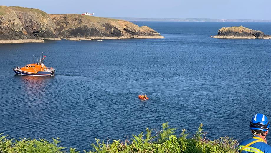 Cowes RNLI’s Tamar class all-weather lifeboat, and its Y boat following behind, in the water at Caerfai Bay