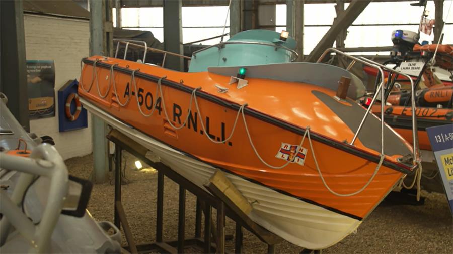 An orange A class RNLI lifeboat at The Historic Dockyard Chatham