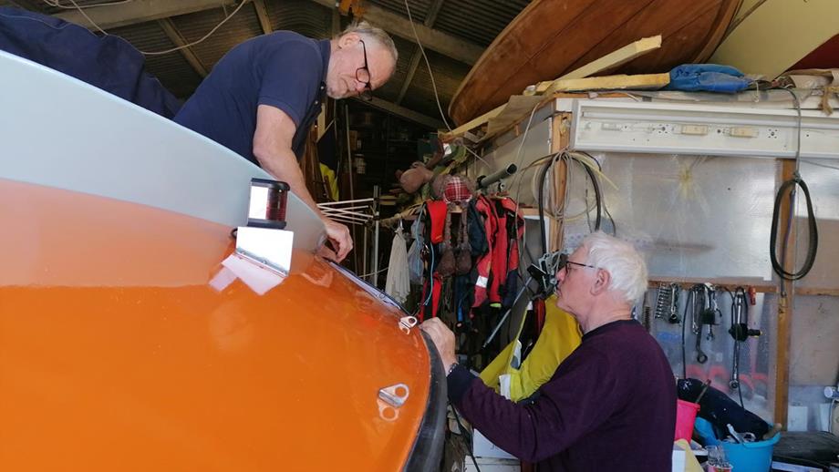 Two men working on the A class lifeboat