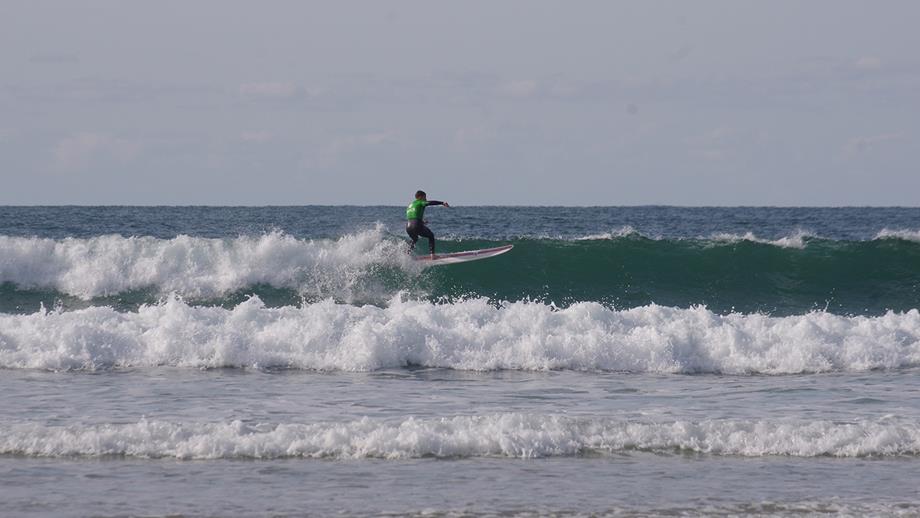 Callum surfing in choppy waters, at a competition in Newquay