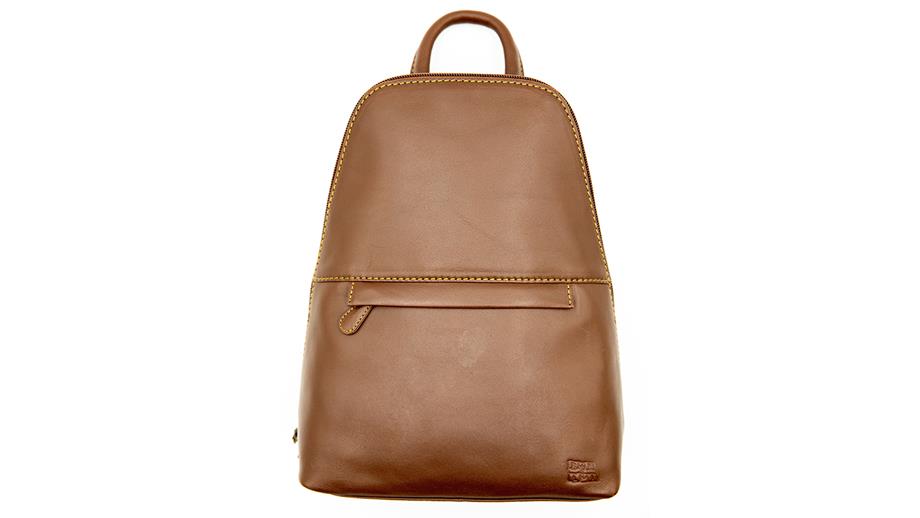 A mid-brown leather rucksack with mustard yellow stitching and a zip running over the top. There is also a zippered pocket at the front. Embossed in the right-hand lower corner is the RNLI flag logo. 