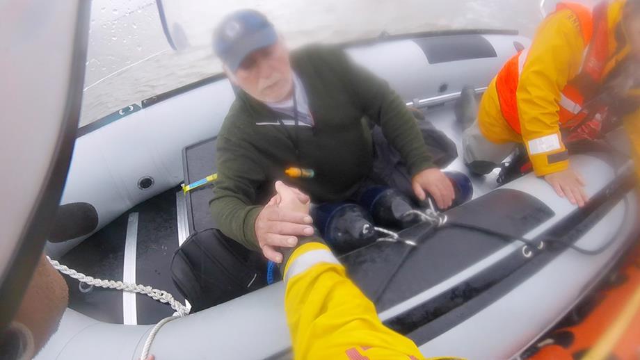Allan being transferred to the RNLI's D class inshore lifeboat