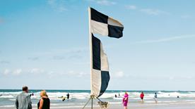 Black and white flag at the beach