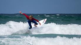 RNLI Lifeguard and sponsored surfer Mark Harris (Egor) surfing at Fistral Beach, Newquay