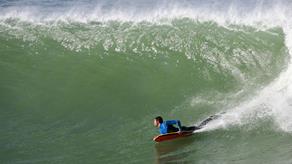 Bodyboarding on a large wave