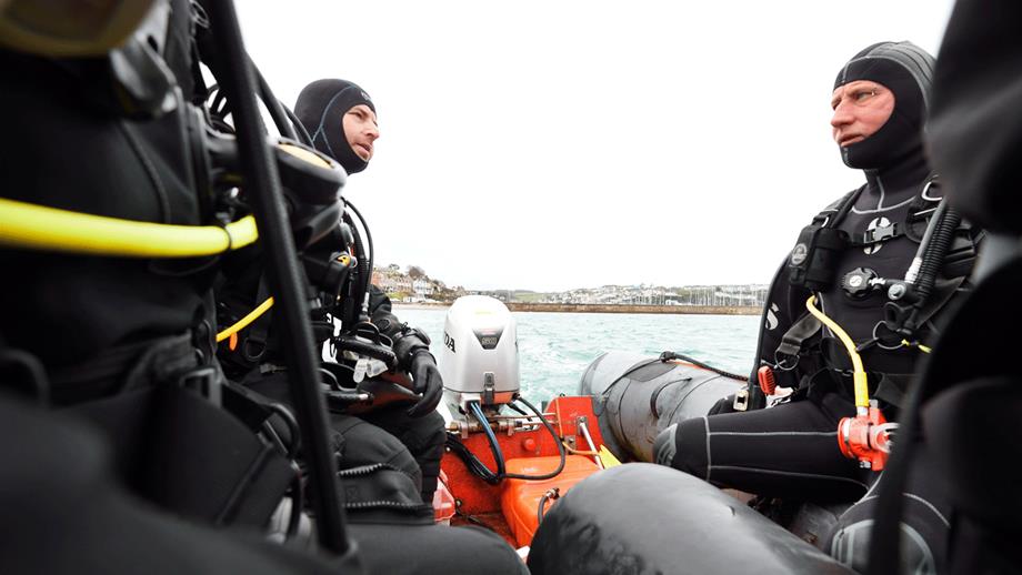 Two divers onboard a rigid inflatable boat