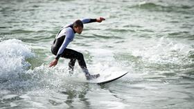 Surfer at Boscombe Beach, Bournemouth