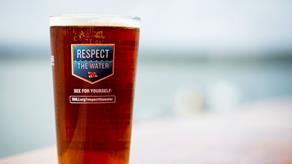 A pint of lager in a Respect the Water glass