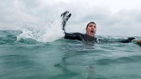 Man struggling to stay afloat in the water