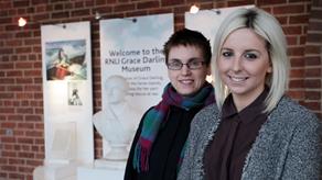 RNLI heritage volunteers outside the RNLI Grace Darling Museum at Bamburgh, Northumberland