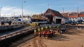 Anstruther lifeboat station with full crew outside 