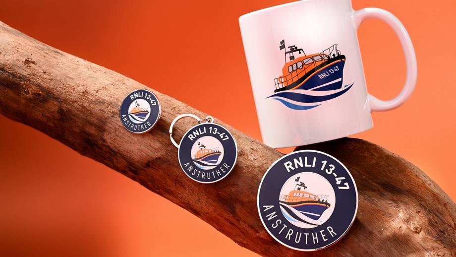 Lifeboat 13-40 range of high-quality, affordable products resting on a tree branch and orange background. Mementos that show the 13-40 illustration of the boat and number
