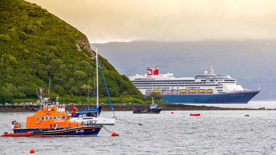 Fred Olsen ship and RNLI boat on the water
