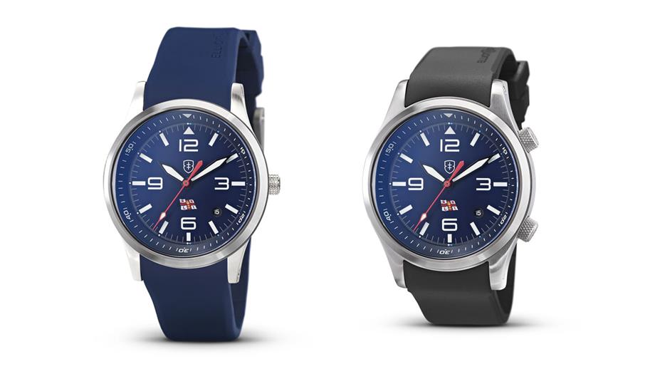 The RNLI Kimmeridge watch on the left designed for women and the RNLI Canford watch on the right designed for men. Both feature a blue face with luminous numbers and the RNLI flag. 