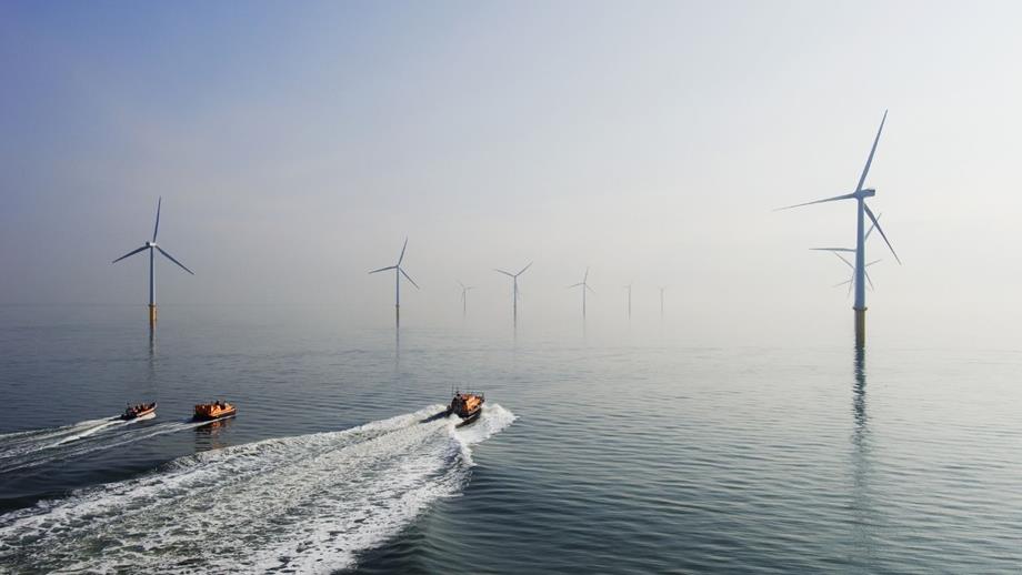 RNLI boats navigating between Ørsted wind farm in the ocean