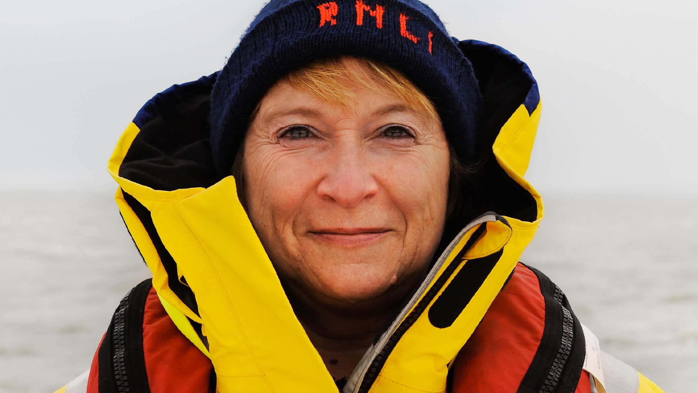 A female crew member looking directly into the camera