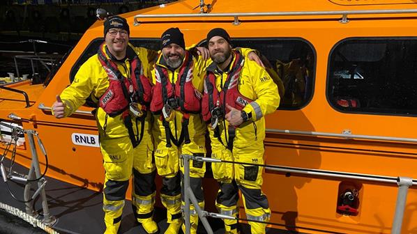 Newly trained Invergordon Crew Members Lee Falkiner, Danny Simpson and Andy Haines looking very happy in their crew kit aboard the station’s Shannon class lifeboat