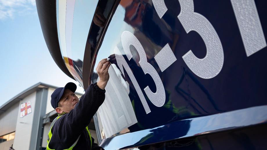 An RNLI technician applying the lifeboat number RNLI 13-44 to the hull of the first legacy lifeboat. The number contains thousands of generous supporters’ names who all left a gift in their Will to the RNLI.