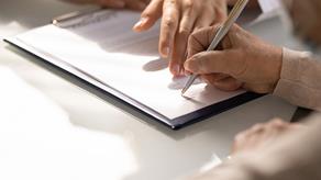 Clipboard with form being filled out
