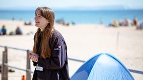 Face-to-face fundraiser smiling on the beach