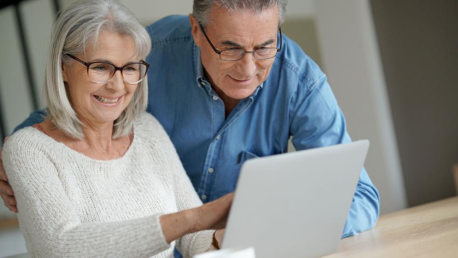 Two people looking at computer