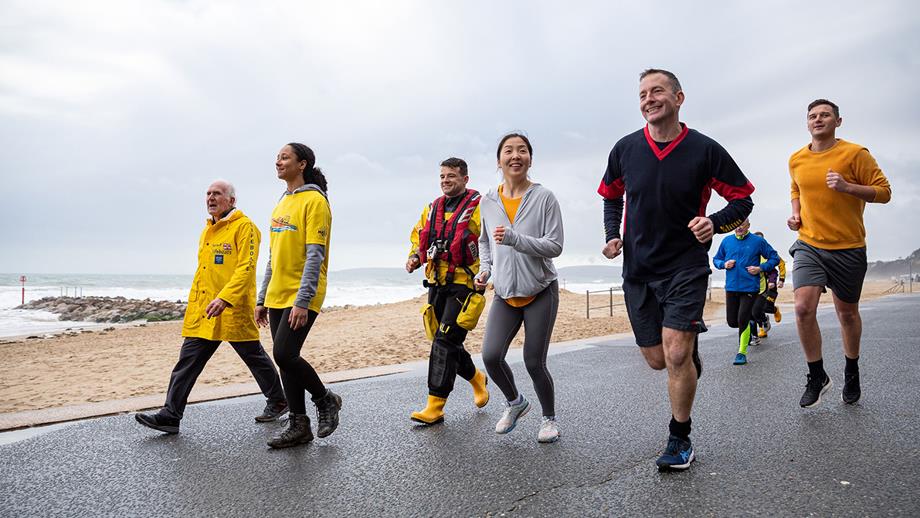 A group of runners, including RNLI crew members, lifeguards, fundraisers taking part in the Mayday Mile.