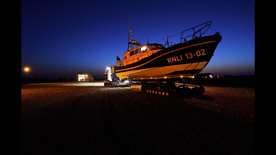 Dungeness RNLI’s Shannon class lifeboat on the Shannon Launch and Recovery Vehicle in the dark.