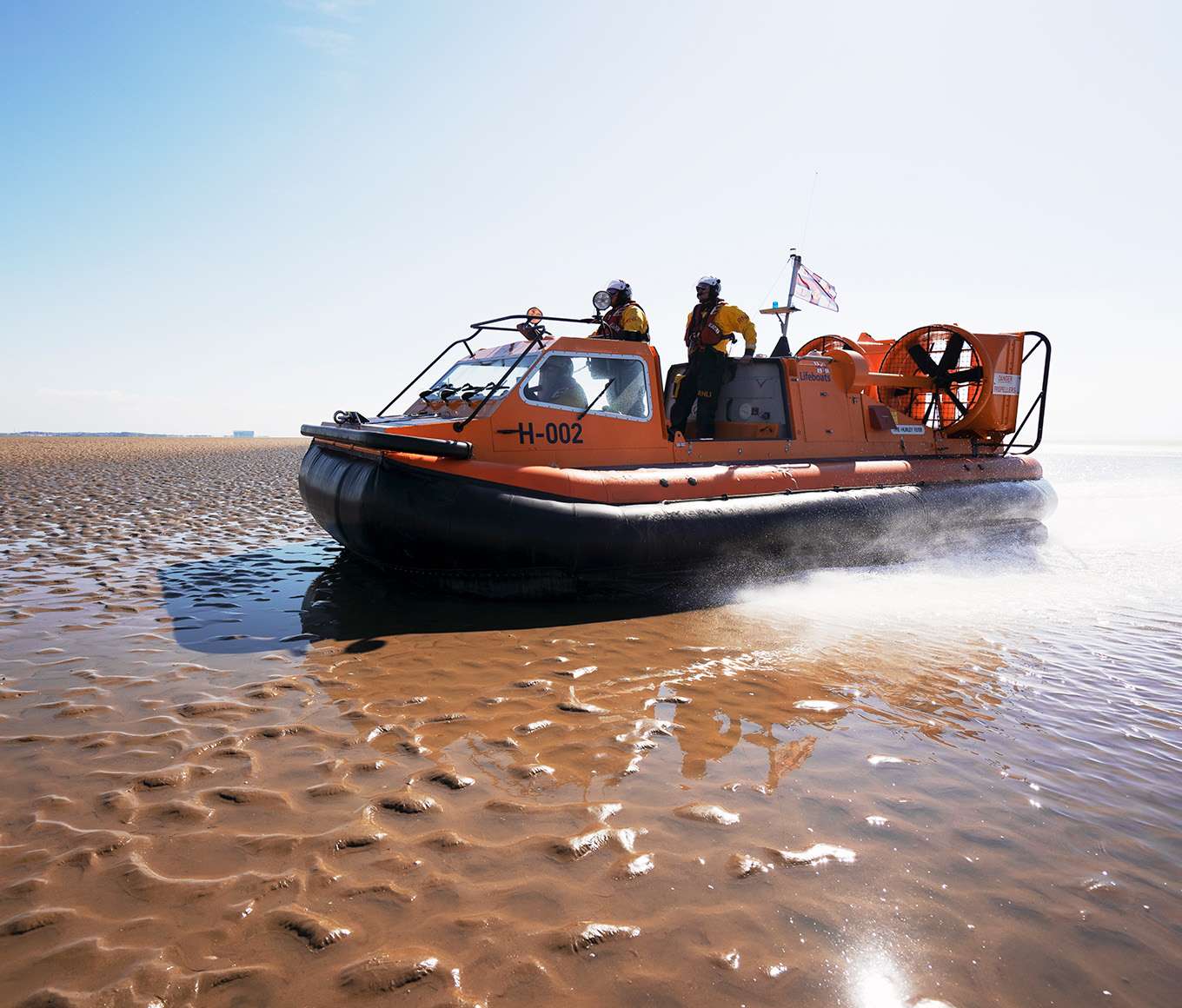 Morecambe hovercraft on a beach on a bright sunny day.