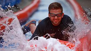 A man joining in an RNLI Slipway Slide event