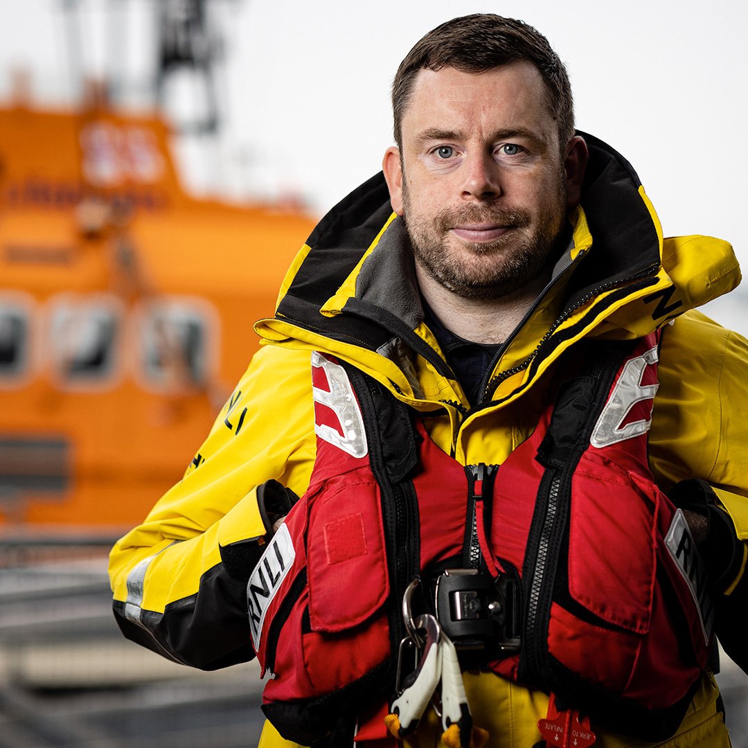 Andrew McHaffie, Senior Fleet Staff Coxswain, facing the camera