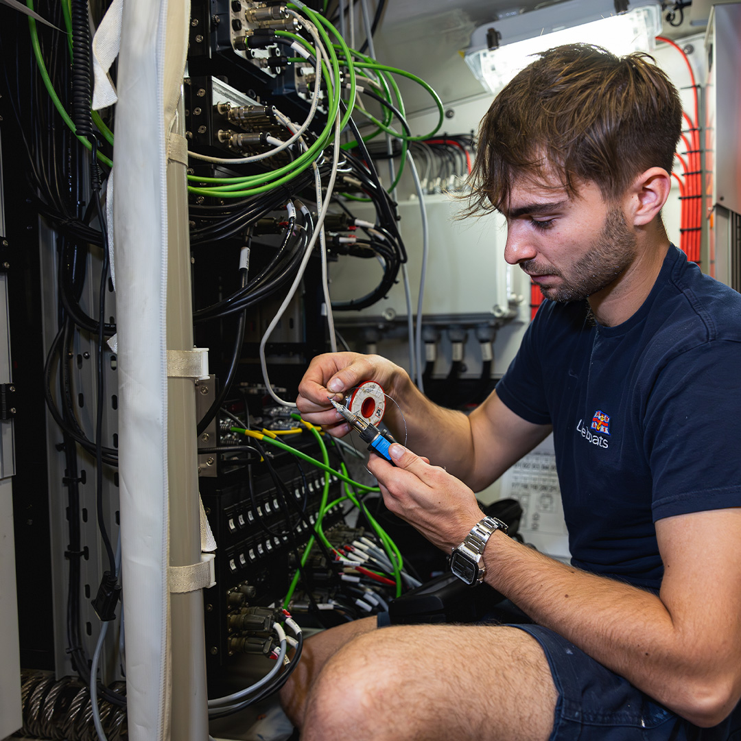 Harvey Zimmer, Engineering Apprentice, using tools.
