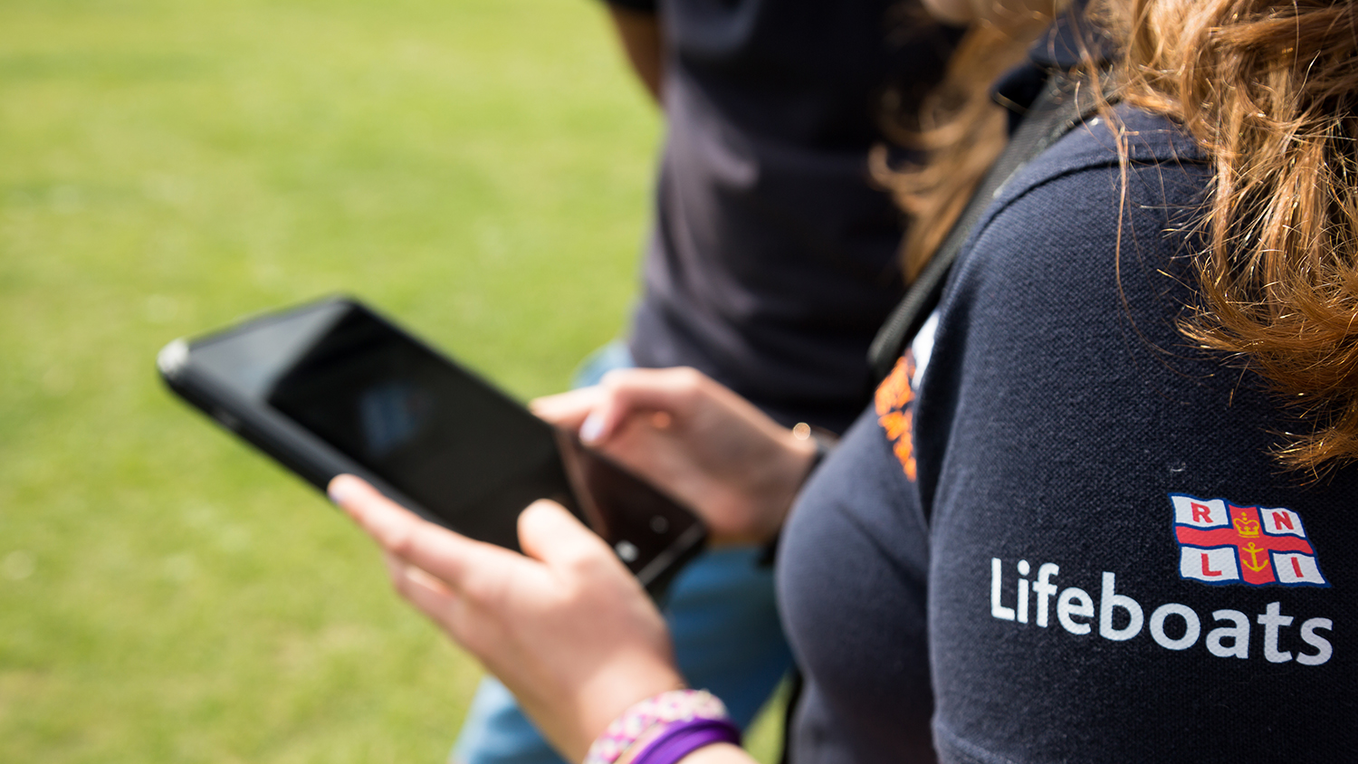 A close-up of a woman using a smartphone