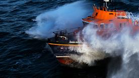 A Severn class lifeboat crashing through the waves.