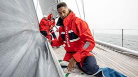 People on a boat in Helly Hansen kit