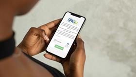 A person using a mobile phone to access a self-referral system called OPAS-G2