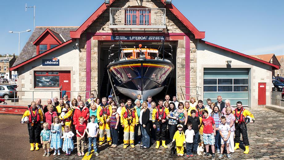 A group shot of Anstruther lifeboat volunteers with their supporting families and community