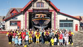 A group shot of Anstruther lifeboat volunteers with their supporting families and community