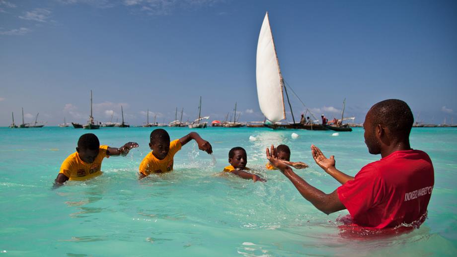 Boys learn to swim in an Aquatic Survival lesson in Nungwi, Zanzibar