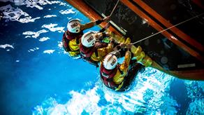 Lifeboat crew self-righting a D class lifeboat in RNLI College’s wave tank