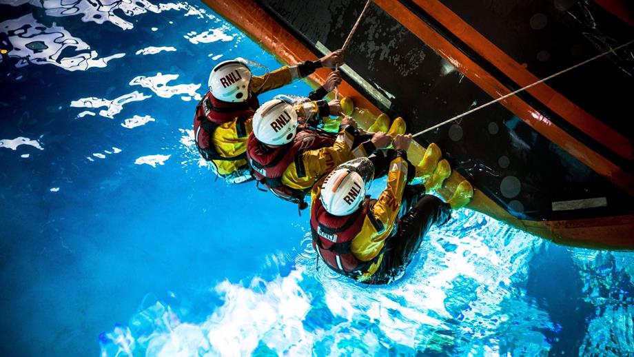Lifeboat crew training in sea survival pool