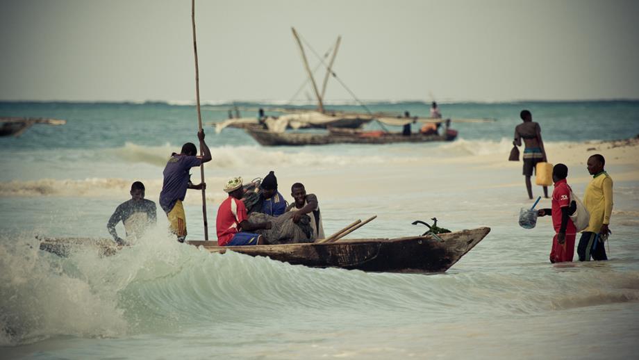 Fishermen in the shore break in Zanzibar