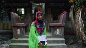 Bhasa project researcher Bithi outside a home in Barisal, Bangladesh