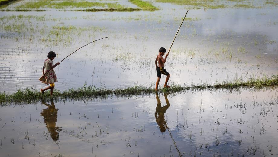 Children playing on flood plains in Bangladesh