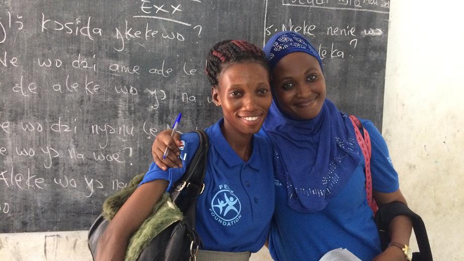 Two Felix Foundation members in a classroom