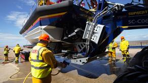 Dungeness mechanic Trevor Bunney inspecting the shannon class lifeboat Jock and Annie Slater